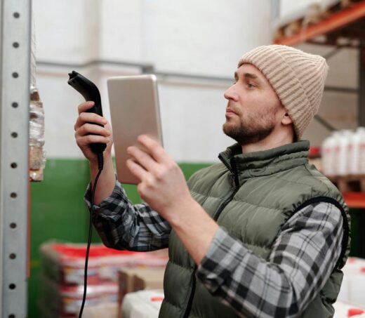 Manufacturing worker collecting operational data using digital tools to support analytics, governance and enterprise data management.