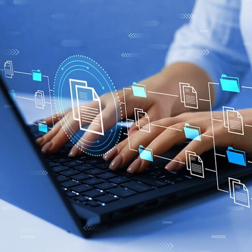 Hands typing on a laptop with digital folders representing enterprise metadata management consulting workflows