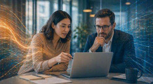 two professionals collaborating on a laptop with abstract overlays representing balance in ai governance consulting services